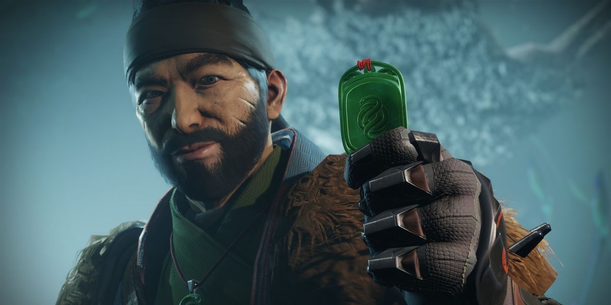 Destiny 2 A close-up of the Drifter with his hand holding a jade coin in focus and the background blurred