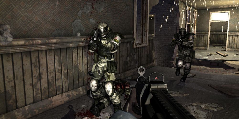 A firefight in F.E.A.R. with soldiers wearing helmeted gear and sparks flying in the background.