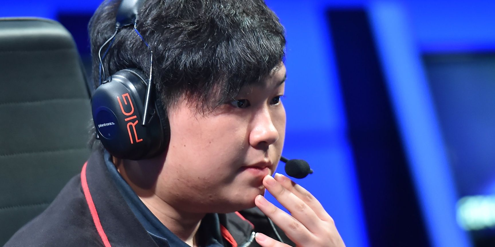 InSec pondering in champ select wearing a headset with hand by his mouth
