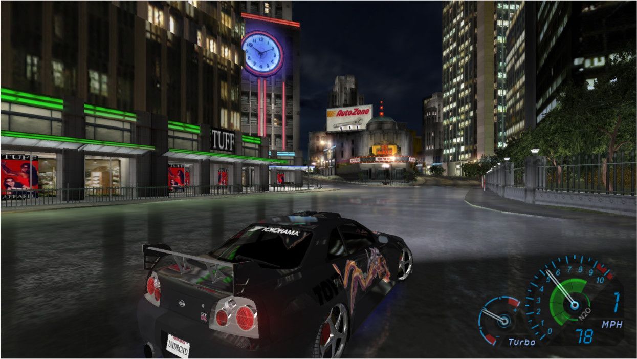 a car speeding round the corner in neon hued olympic city in need for speed underground