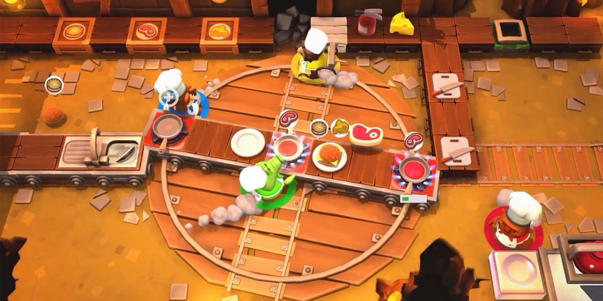 Overcooked 2 four players preparing food and running in Rail Track Stage