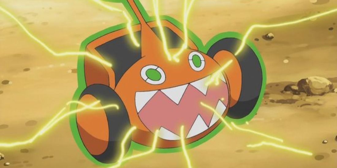 Row Motom, or Rotom-M, surging electricity while posessing a Lawn Mower
