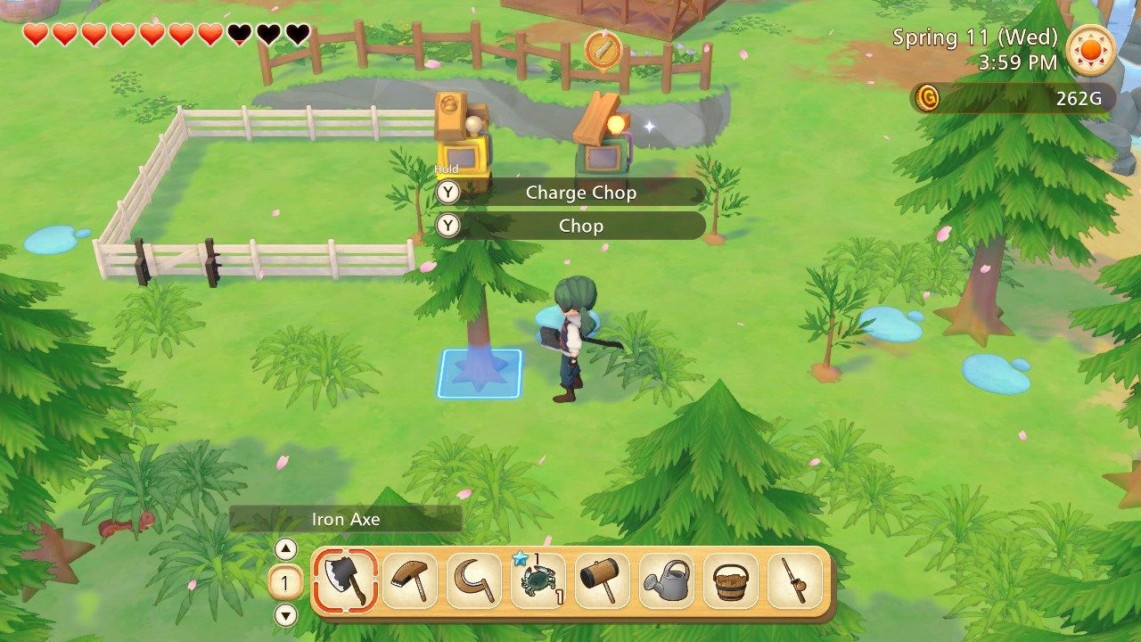 Story of Seasons Pioneers of Olive Town chopping down a tree