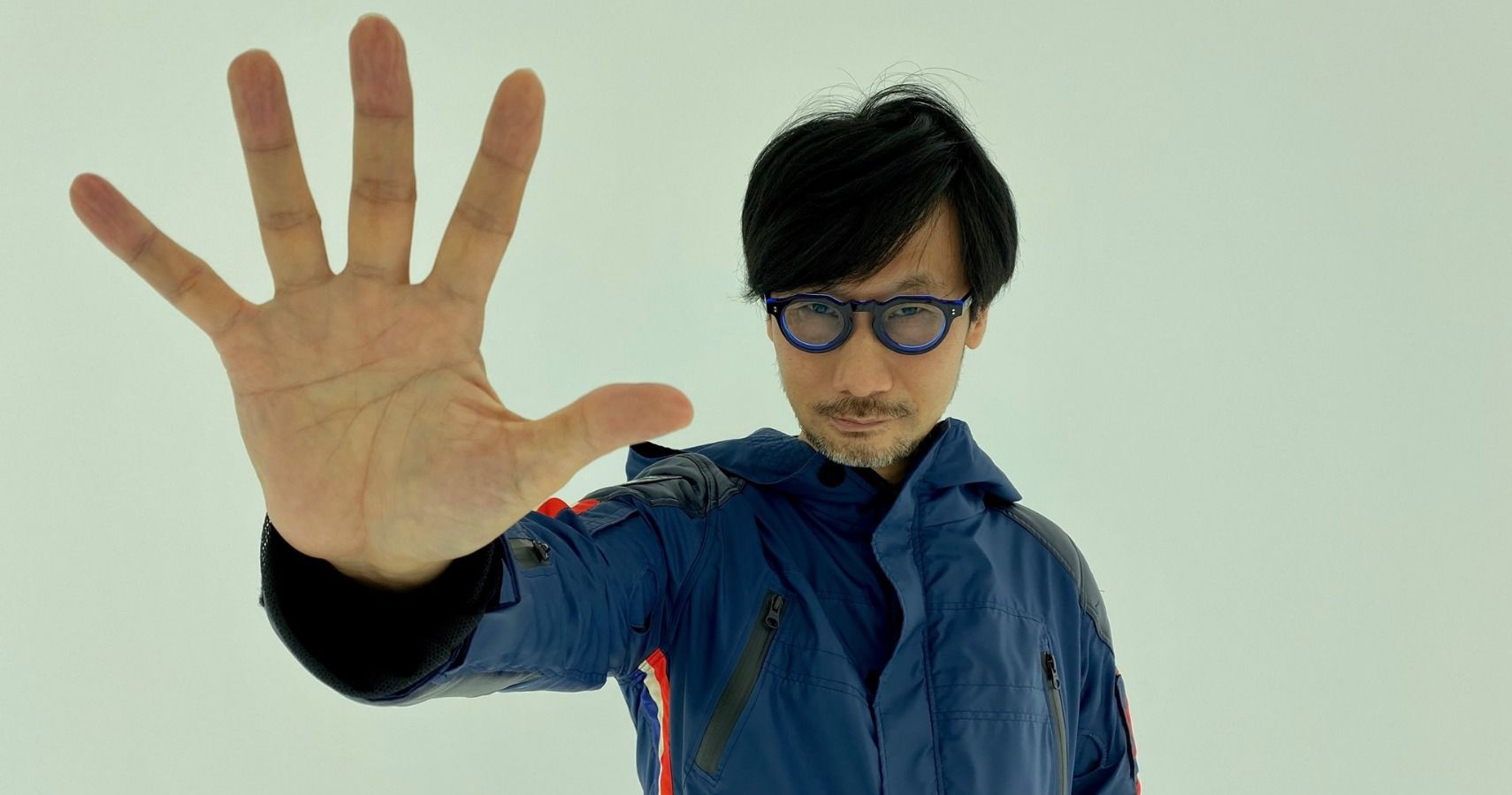 Hideo Kojima holding out his hand