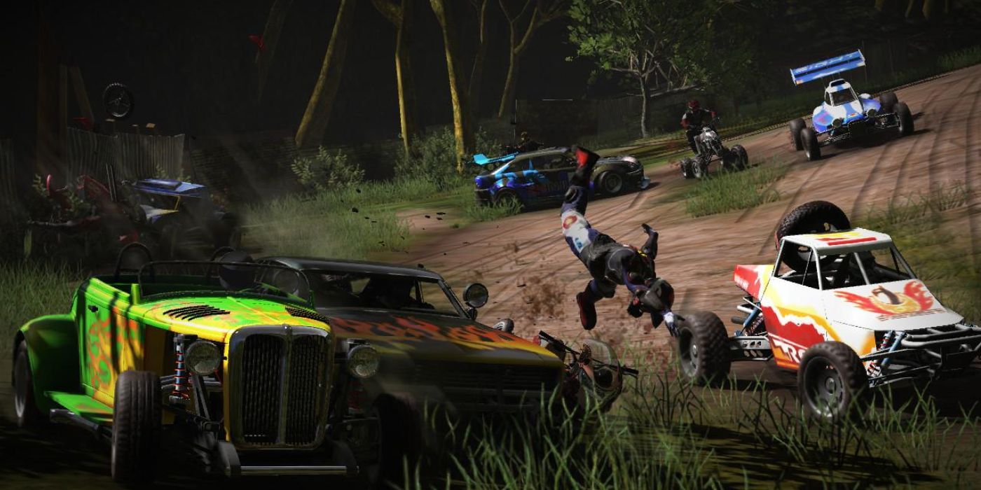 A dirt biker wipes out as a variety of rally cars, dune buggies and an ATV drive past him in MotorStorm Pacific Rift