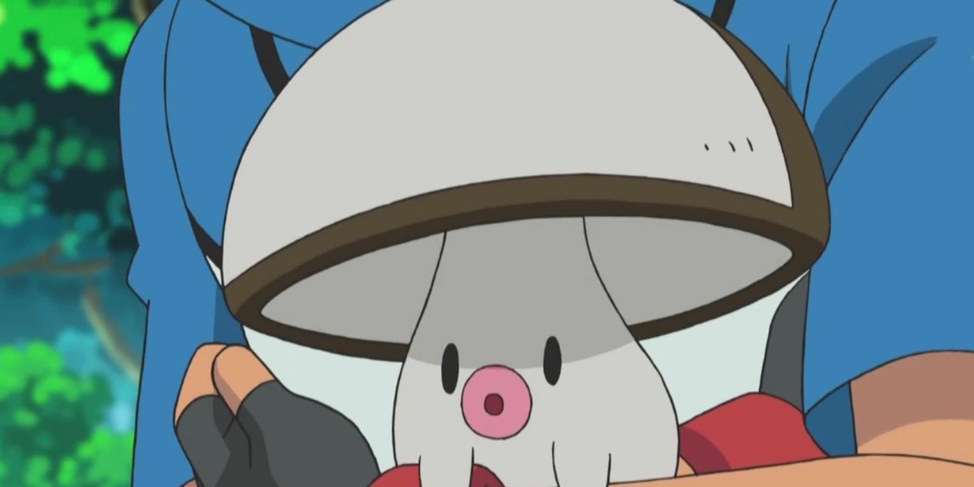 Foongus looks on curiously while in Ash's arms in the Pokemon Anime.