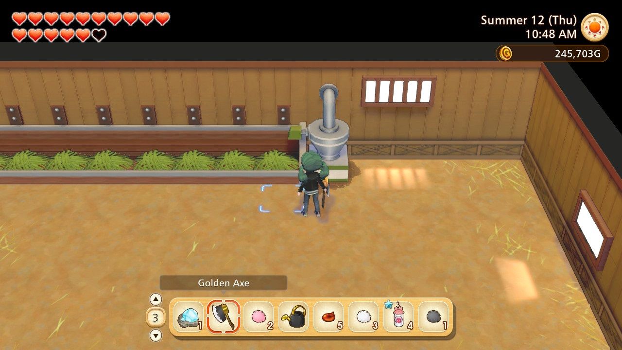 A player using the feeder in the barn in Story of Seasons Pioneers of Olive Town