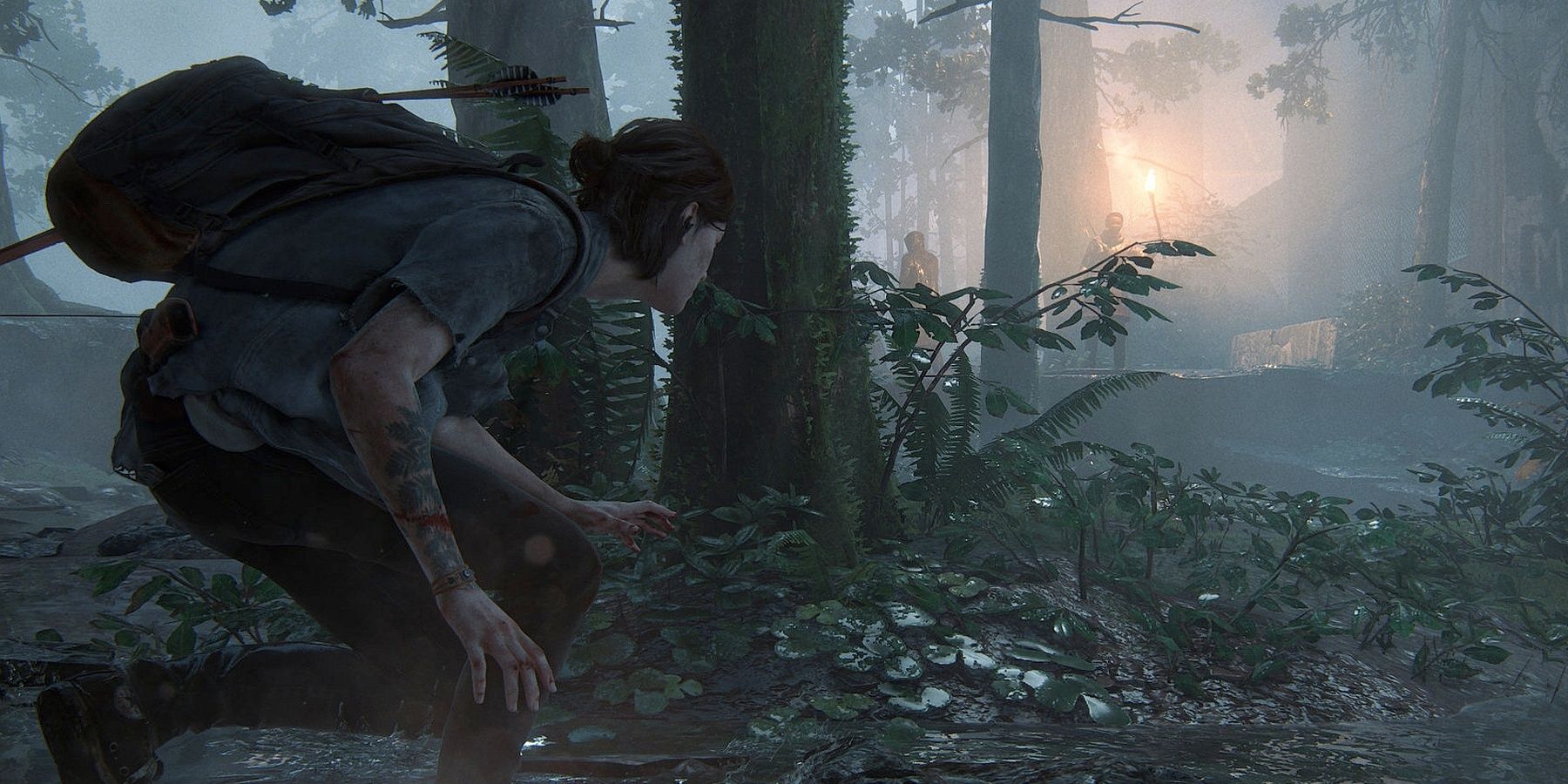 Ellie crouched behind a tree in The Last of Us Part II