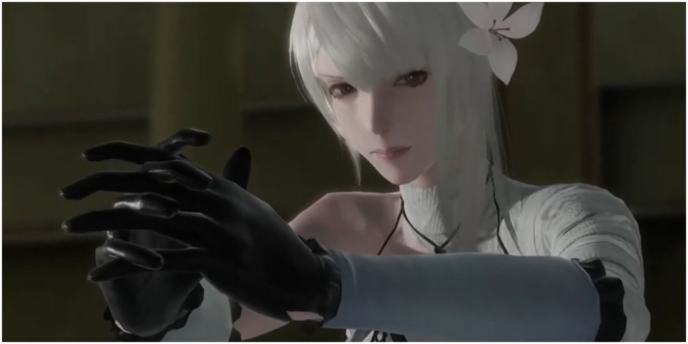 Kainé posing with her hands close to one another