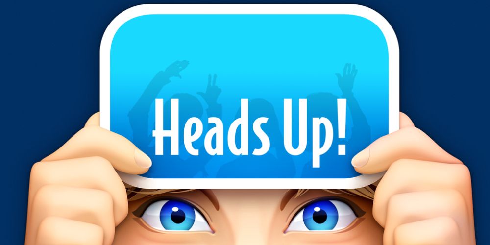 Heads Up! - A Person Holding A Phone Up To Their Forehead