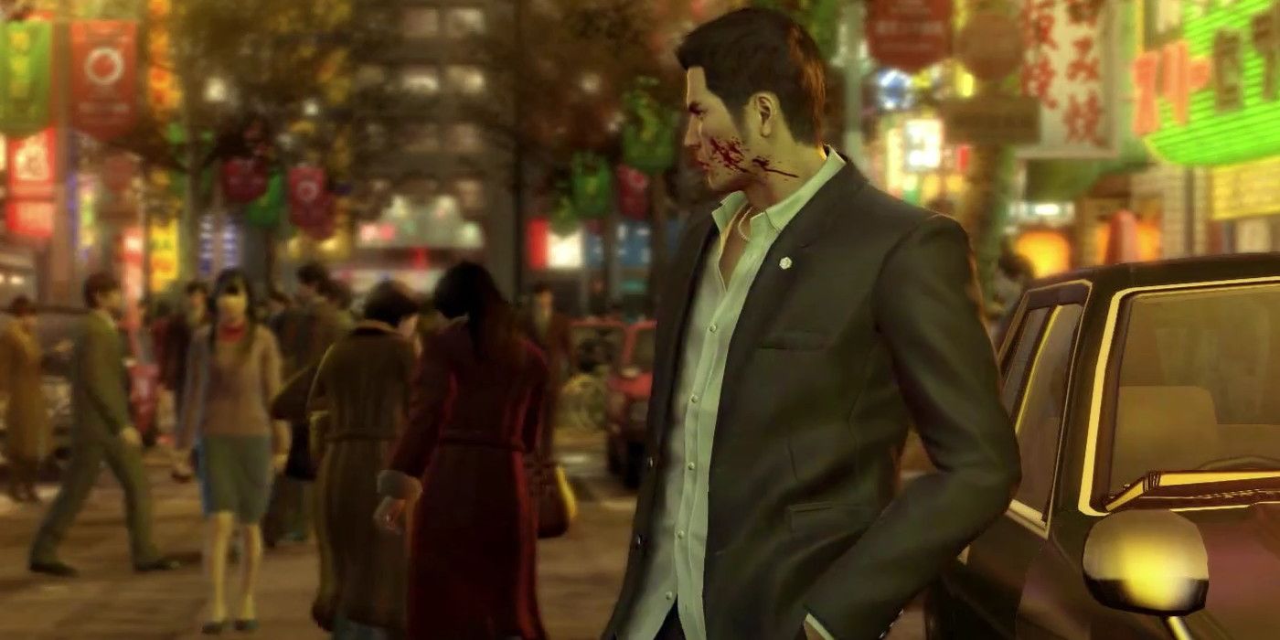 kiryu walks the neon drenched streets with blood smeared on his face