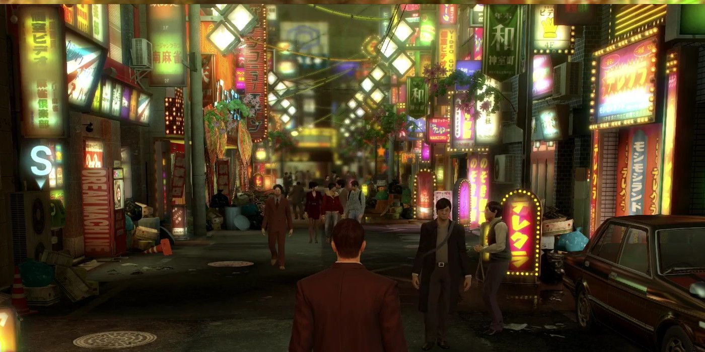 kiryu and his dark suit contrast against the lights of kamurocho