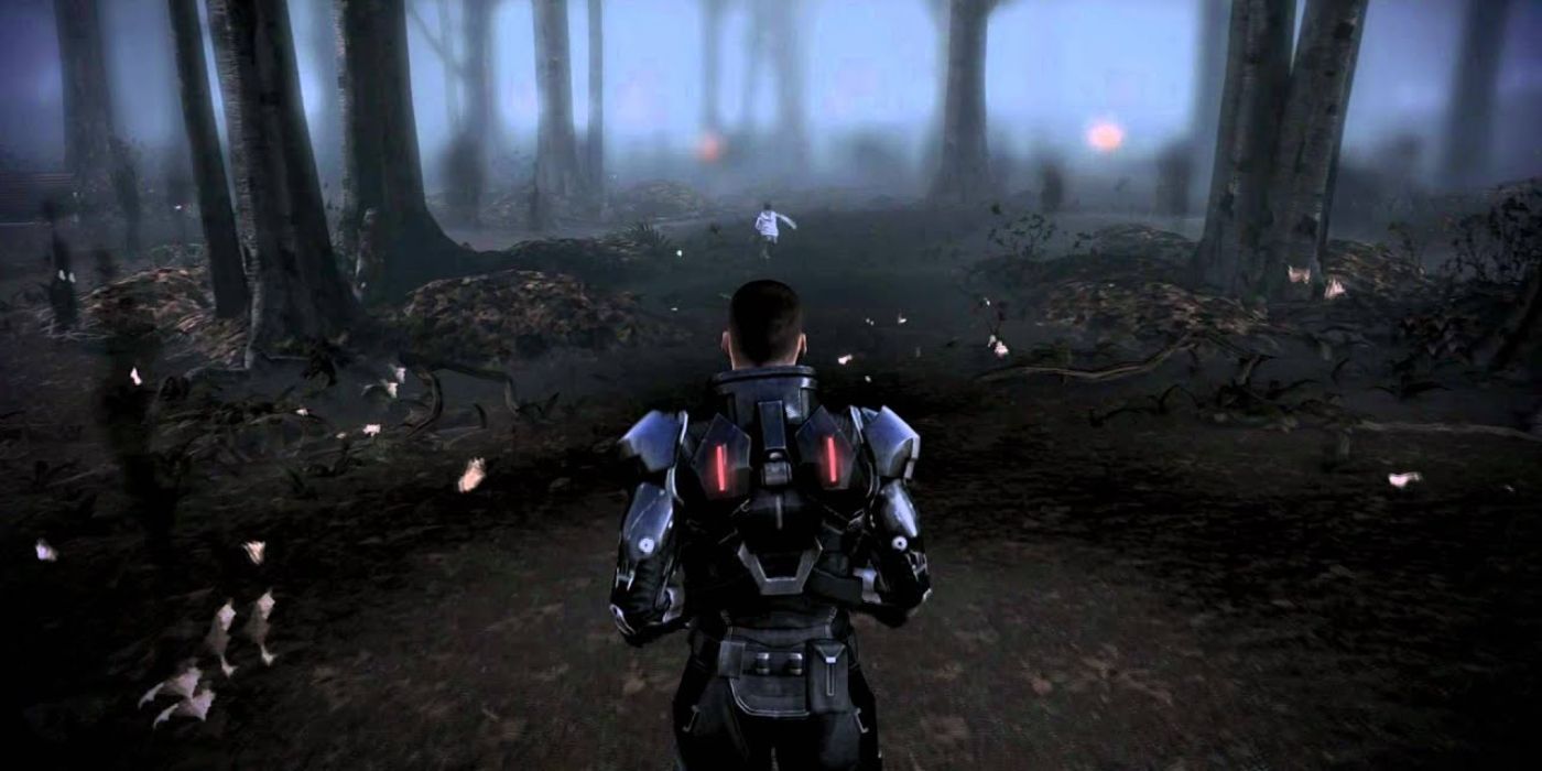 Shepard chases after a boy trying to save him in a dark forest during a dream sequence in Mass Effect 3