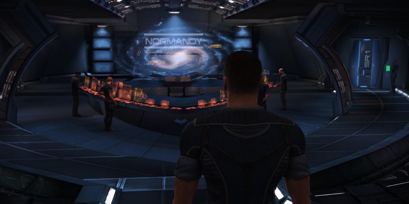 Mass Effect Legendary Edition Gameplay Screenshot Of Male Shepard Standing On The Normandy Bridge Looking At The Galaxy Map