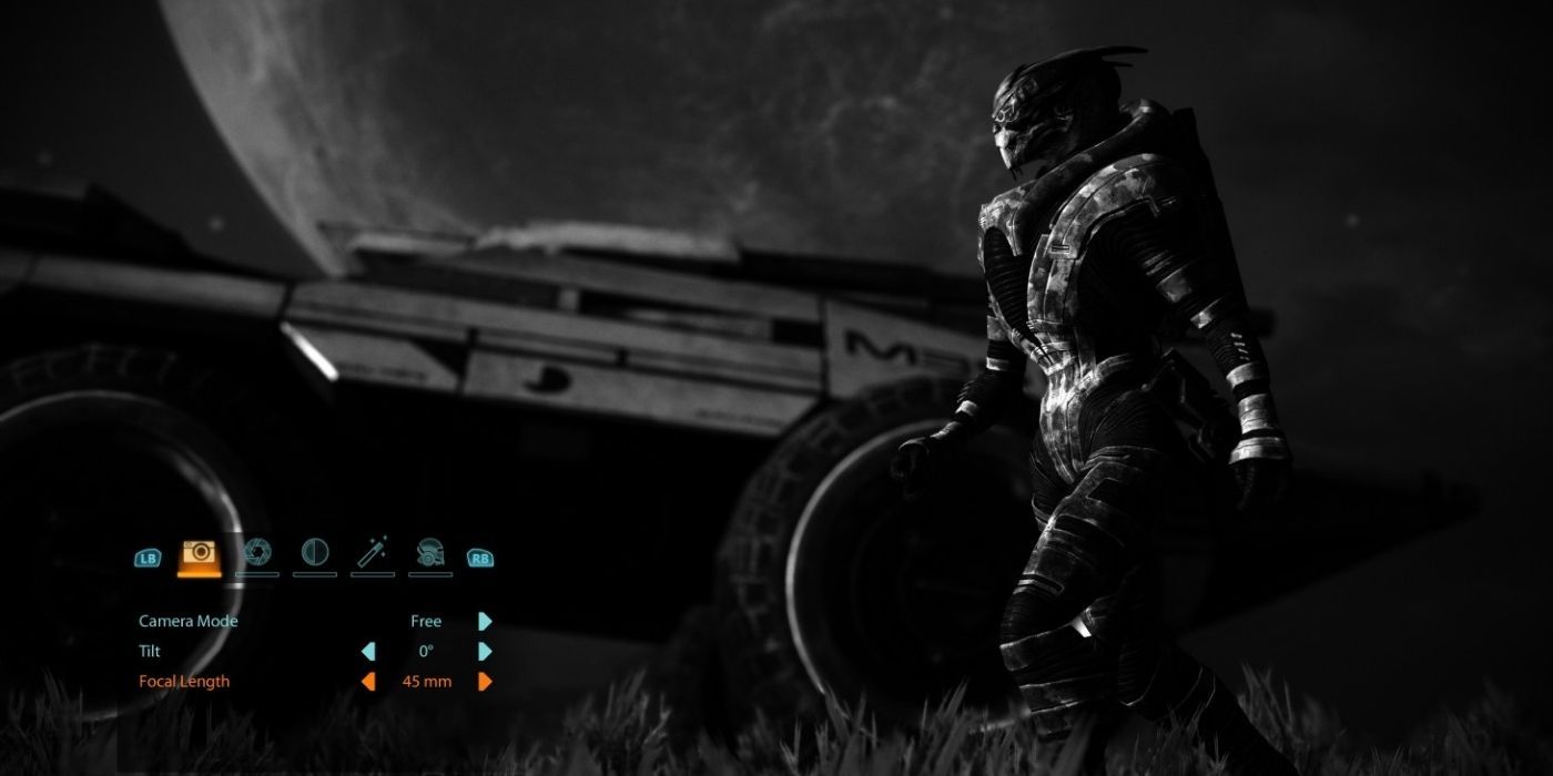 Mass Effect Legendary Edition Gameplay Screenshot Of Photo Mode, Screen In Black And White, Garrus Walking Beside The Mako