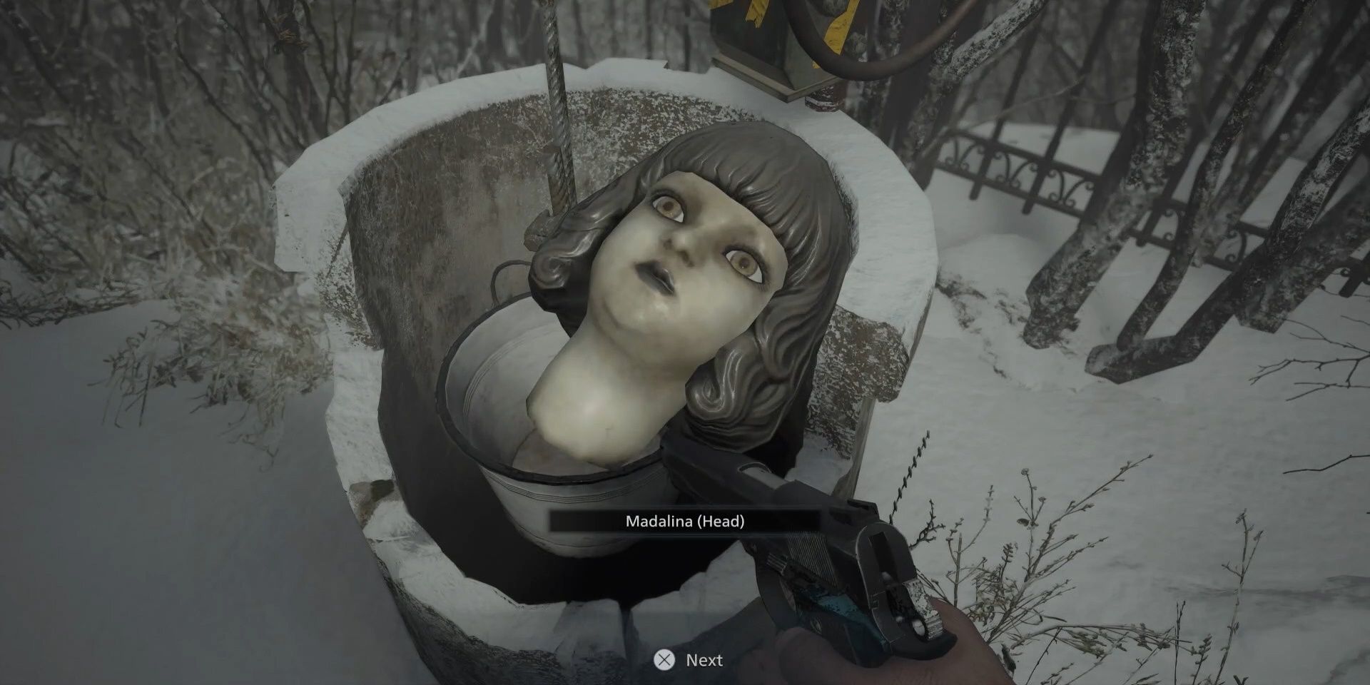 Madelina head in the well in Resident Evil Village
