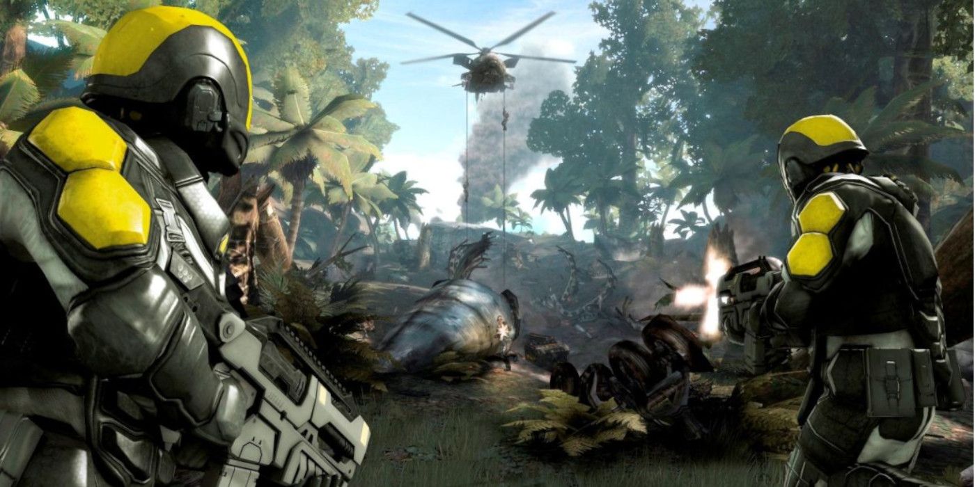 two mantel soldiers watch as a helicopter drops soldiers into a jungle
