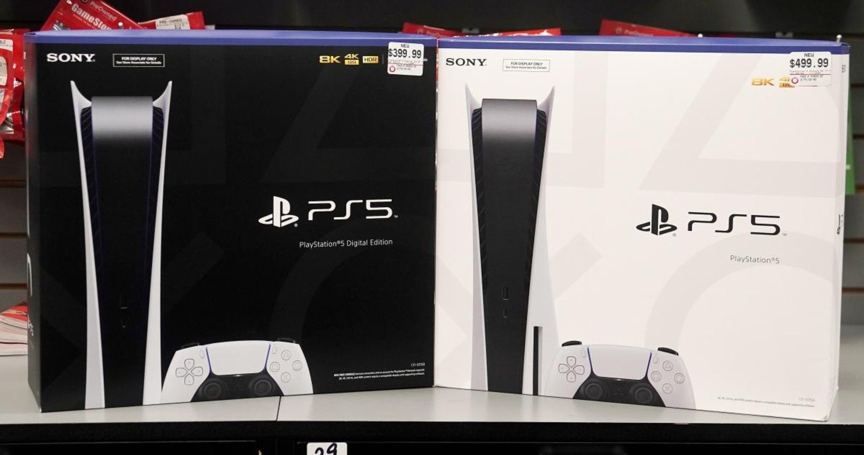 two ps5s on a shelf