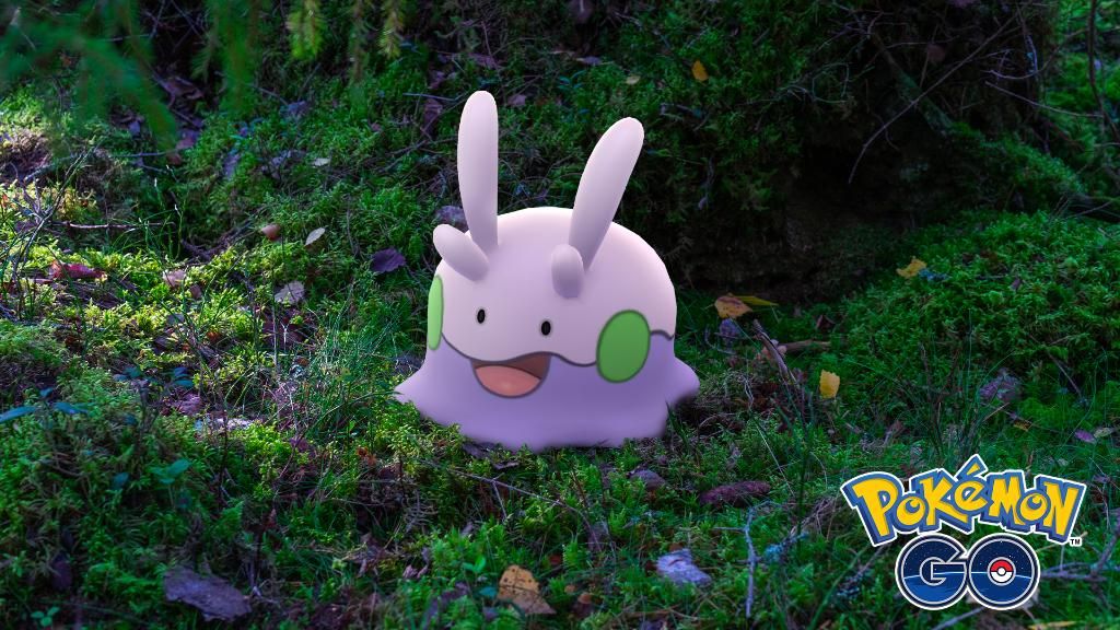 Goomy posing in a forest