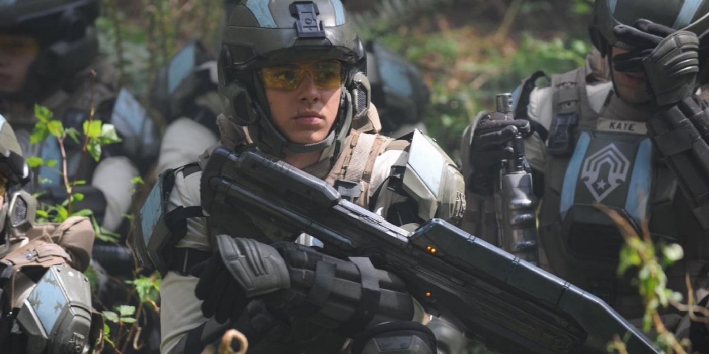 Halo 4 Forward Unto Dawn - Image Of Young Man In Military Armour, Crouching Among Bushes