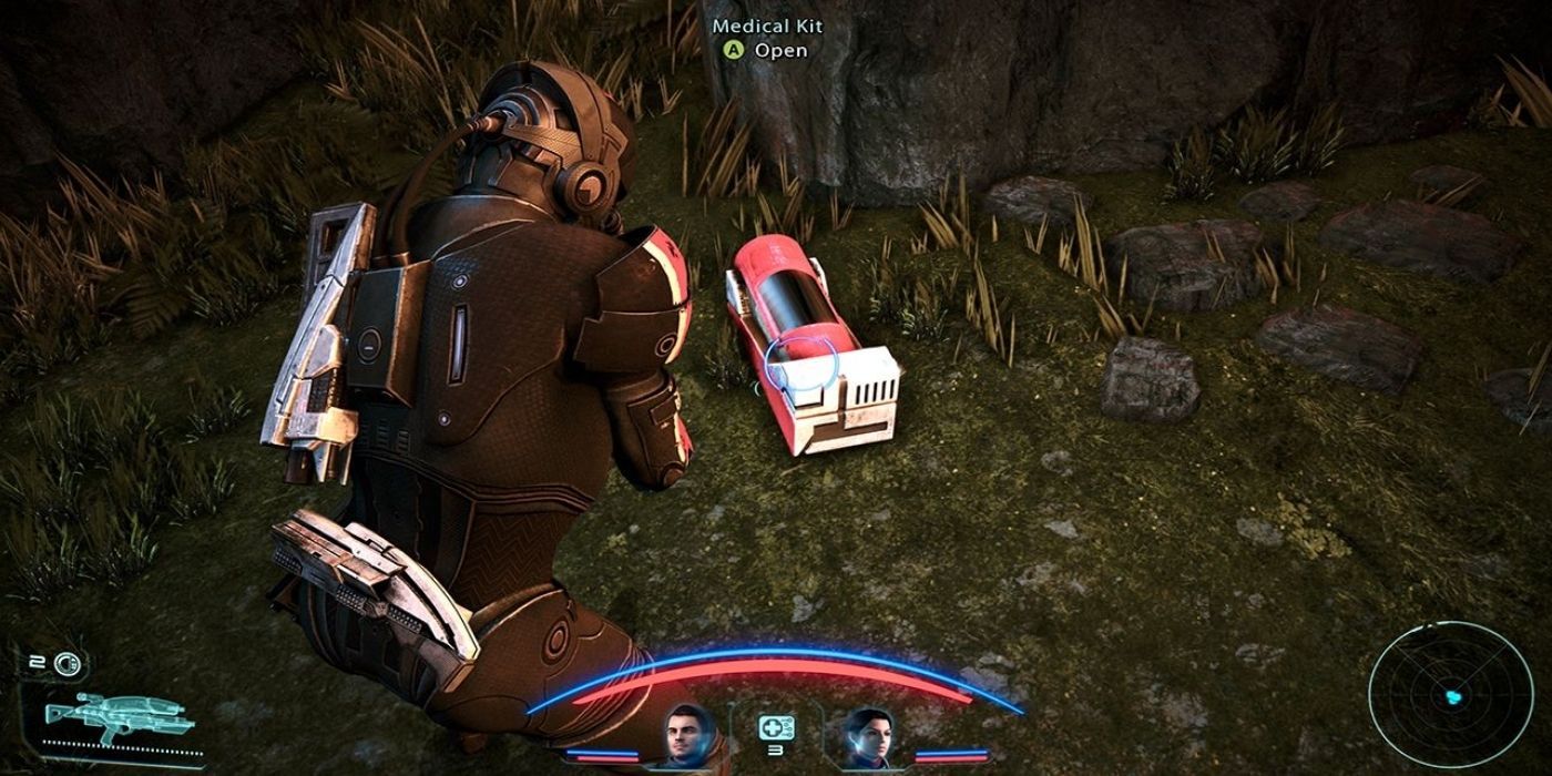 Mass Effect Shepard Crouching Over a Medical Kit on Eden Prime