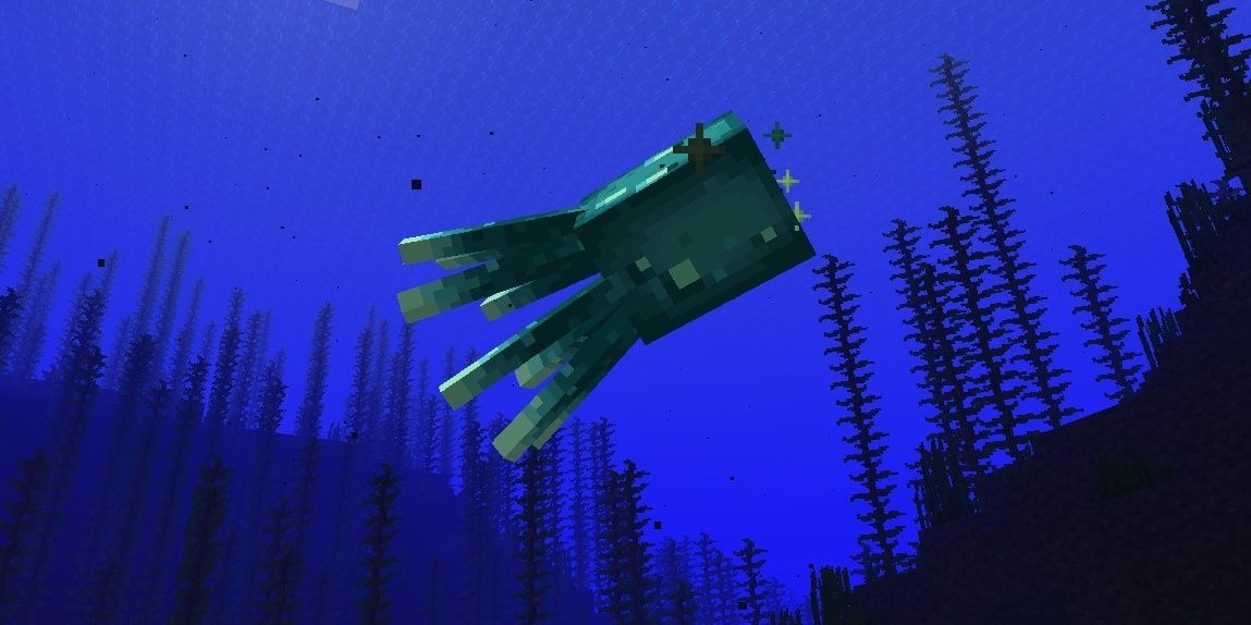 Glow Squids in the ocean in Minecraft