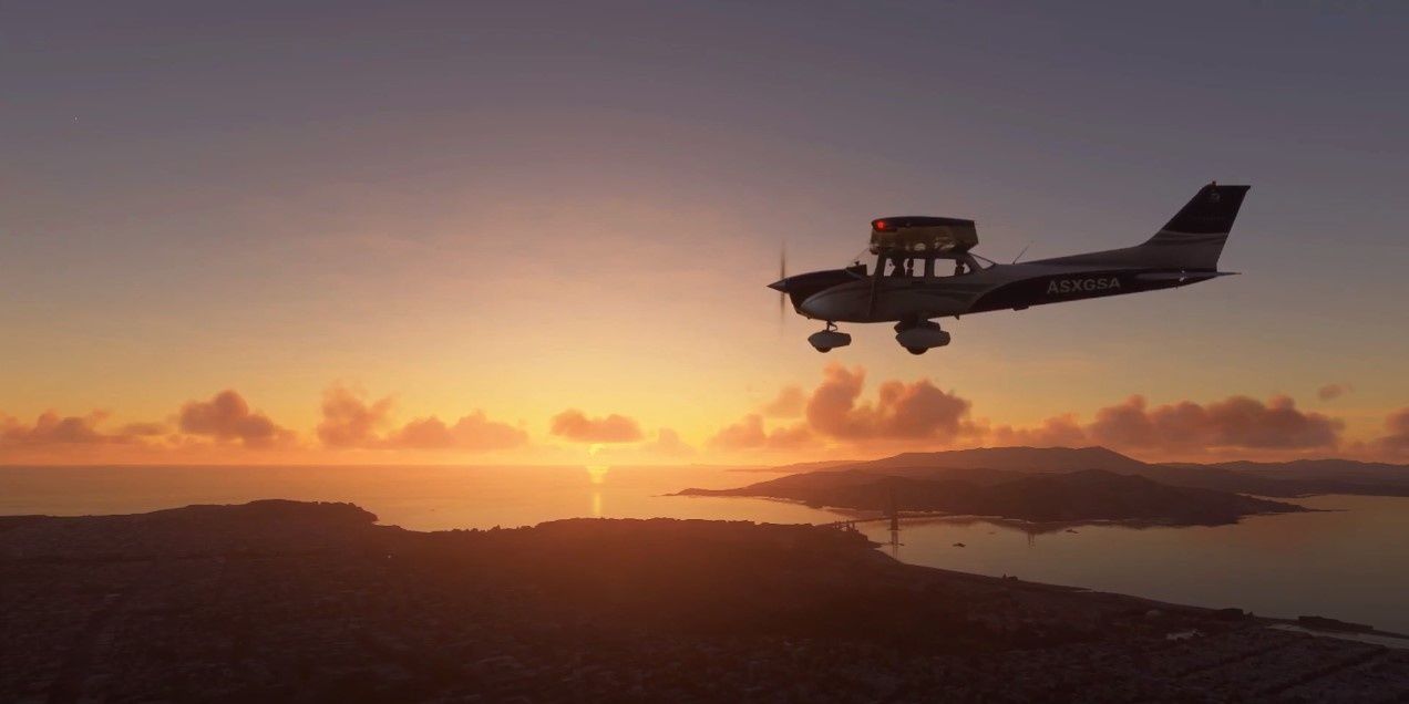 A single engine plane flying over the San Francisco bay at sunset