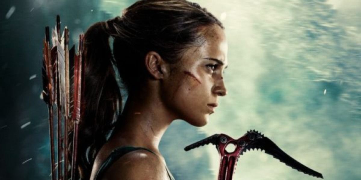 Holding hiking and climbing gear in the Tomb Raider reboot poster
