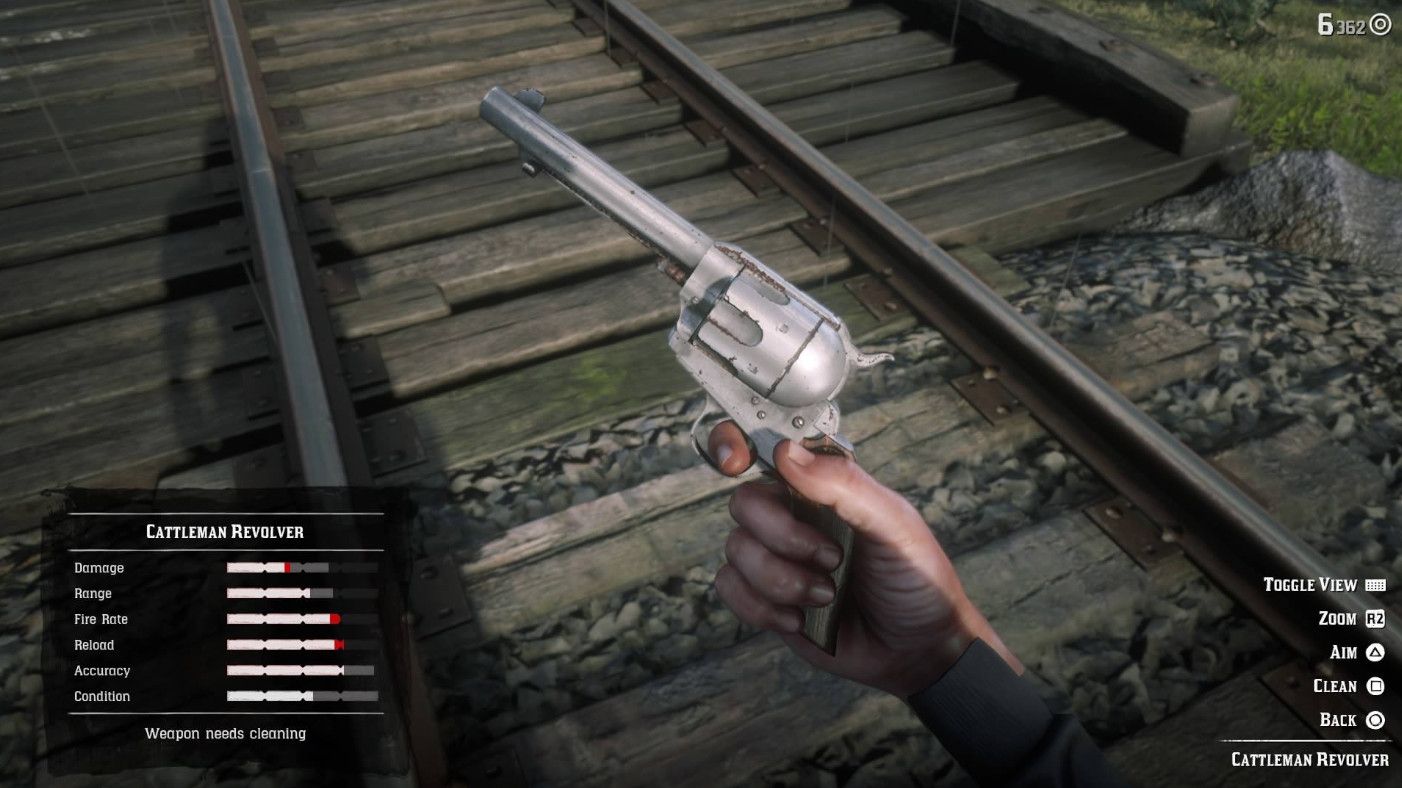 a character inspecting a steel revolver before cleaning it