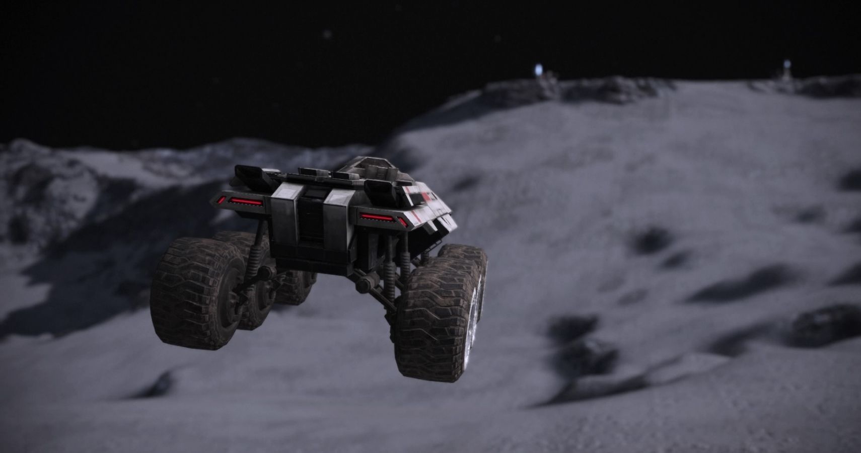 A large vehicle is driving on the moon. It is currently flying through the air, about to land