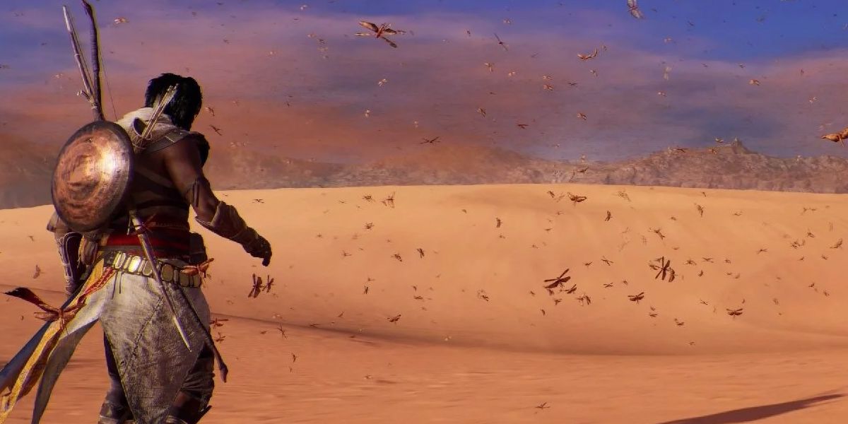 AC Origins a player seeing locusts in the desert