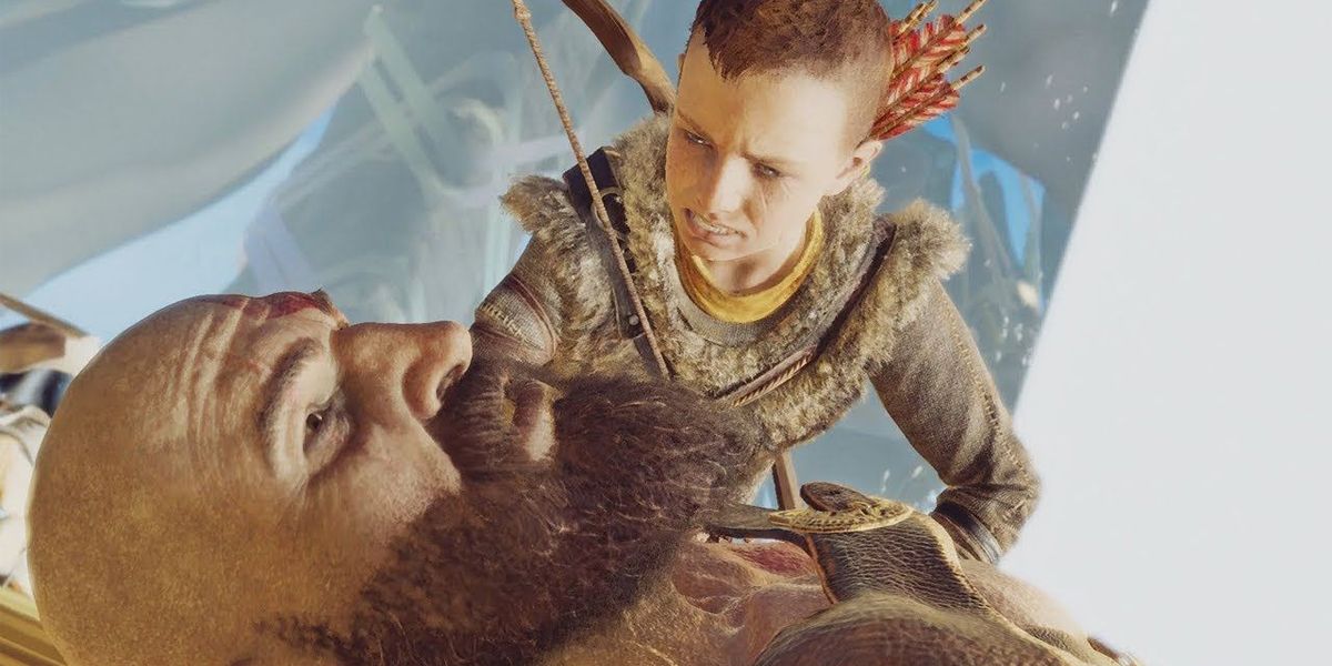 Atreus leaning over Kratos in newest God of War
