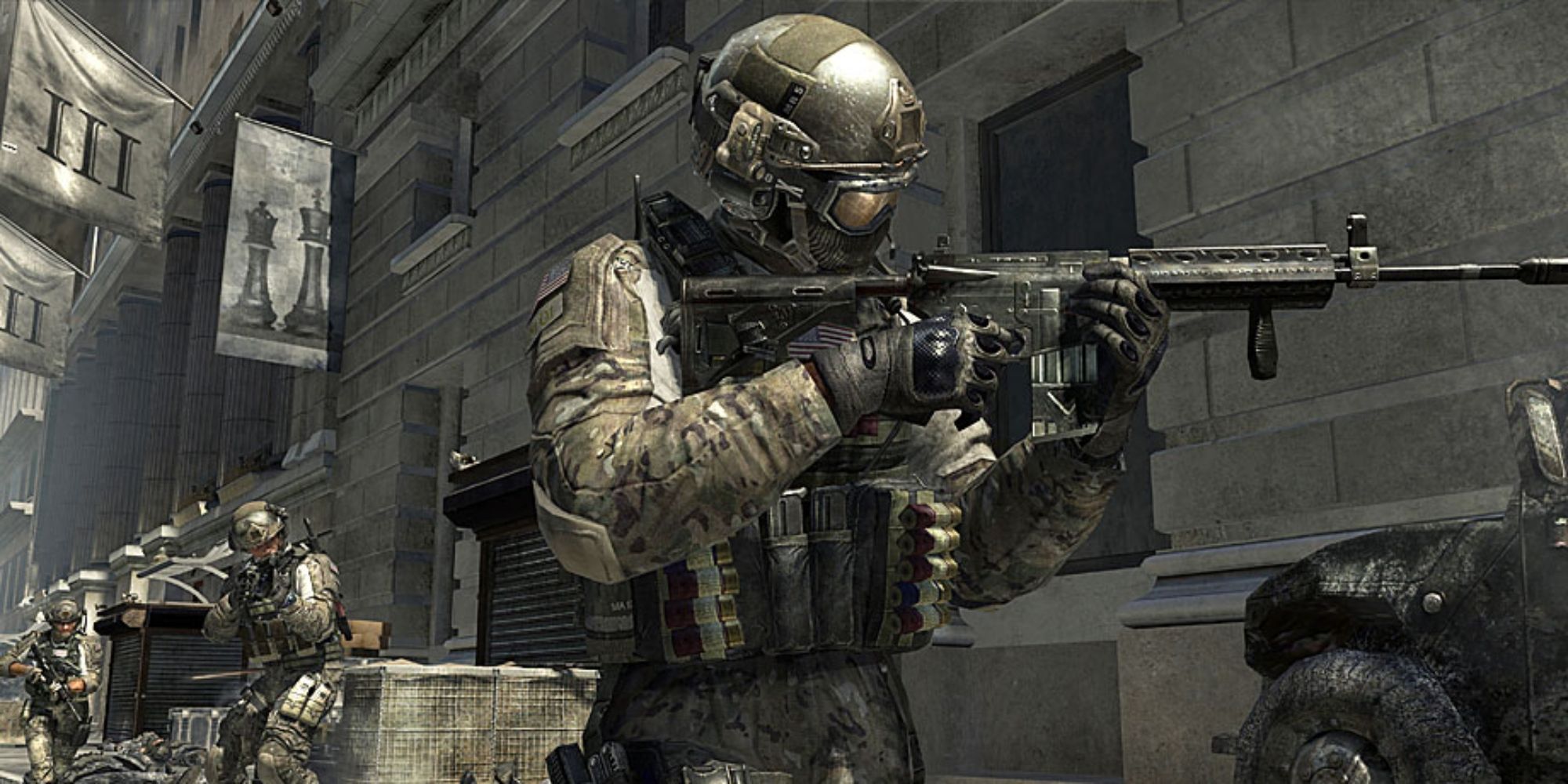 Call Of Duty Modern Warfare 3 Screenshot Of Soldier aiming to his left while a squad is following him.