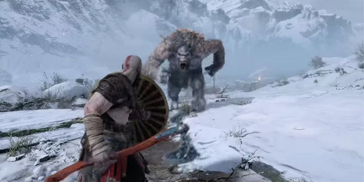 God Of War Kratos staring down a troll with shield in hand
