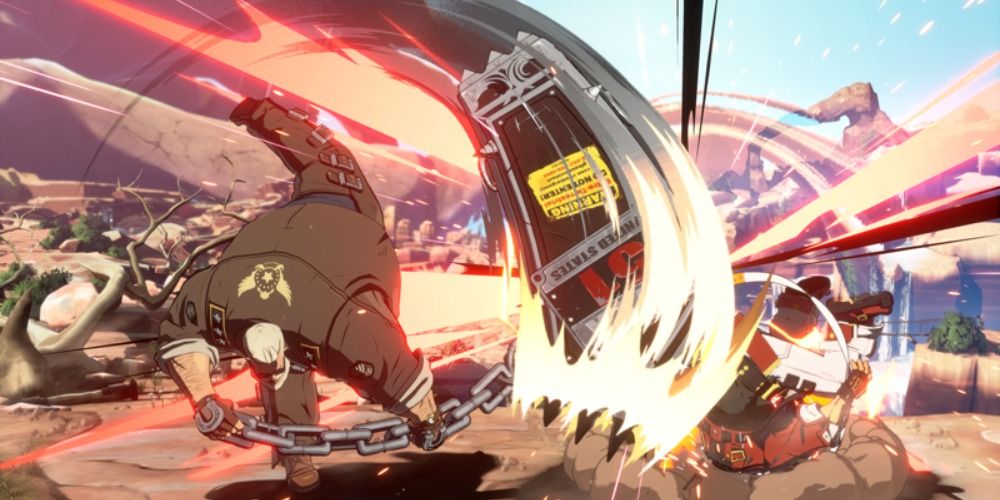 Goldlewis Dickinson swinging his heavy coffin down on Sol Badguy in Guilty Gear Strive.