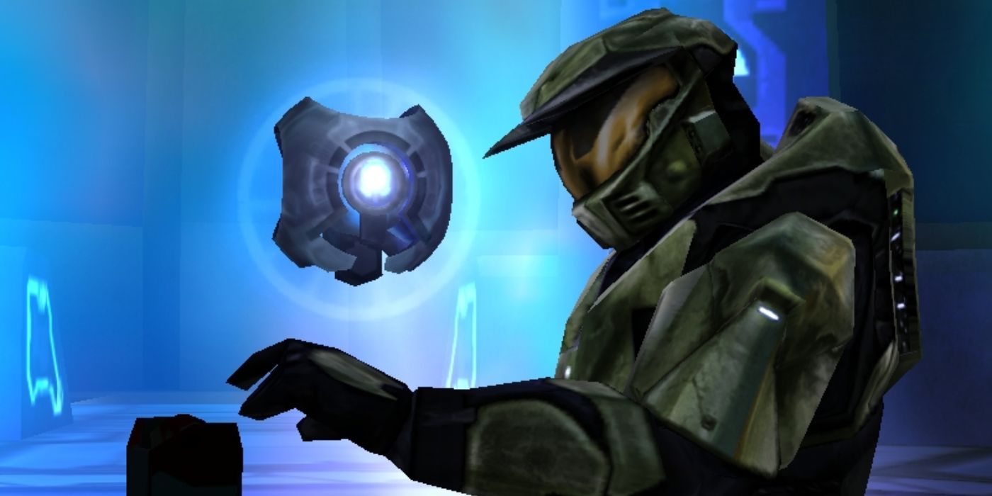 Master Chief (right) retrieves the Halo Activation Index as 343 Guilty Spark looks on