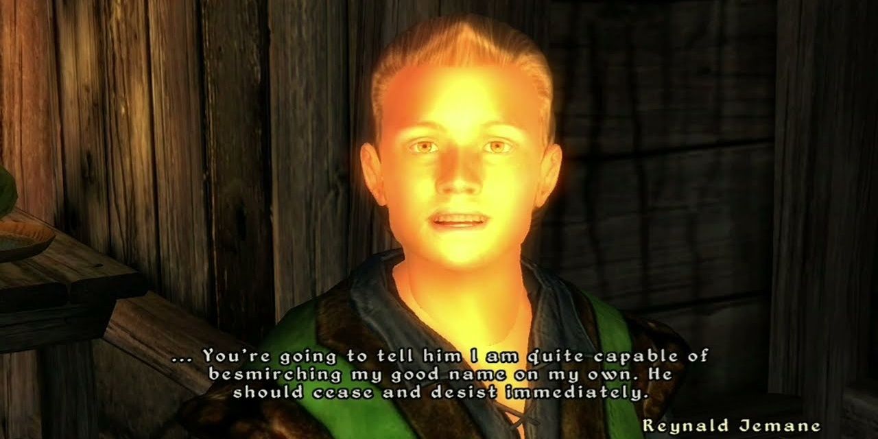 A screenshot from Oblivion, showing Reynald Jemane speaking with the Hero inside the Gray Mare Inn in Chorrol