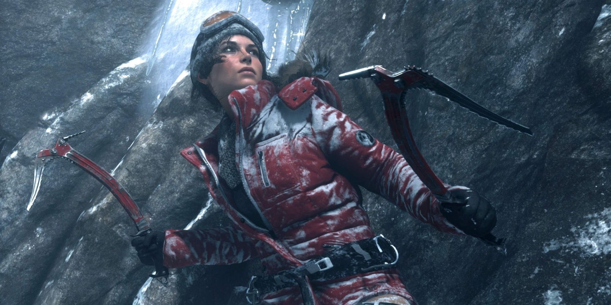 Rise Of The Tomb Raider Screenshot Of Lara Croft With Axes On Mountain