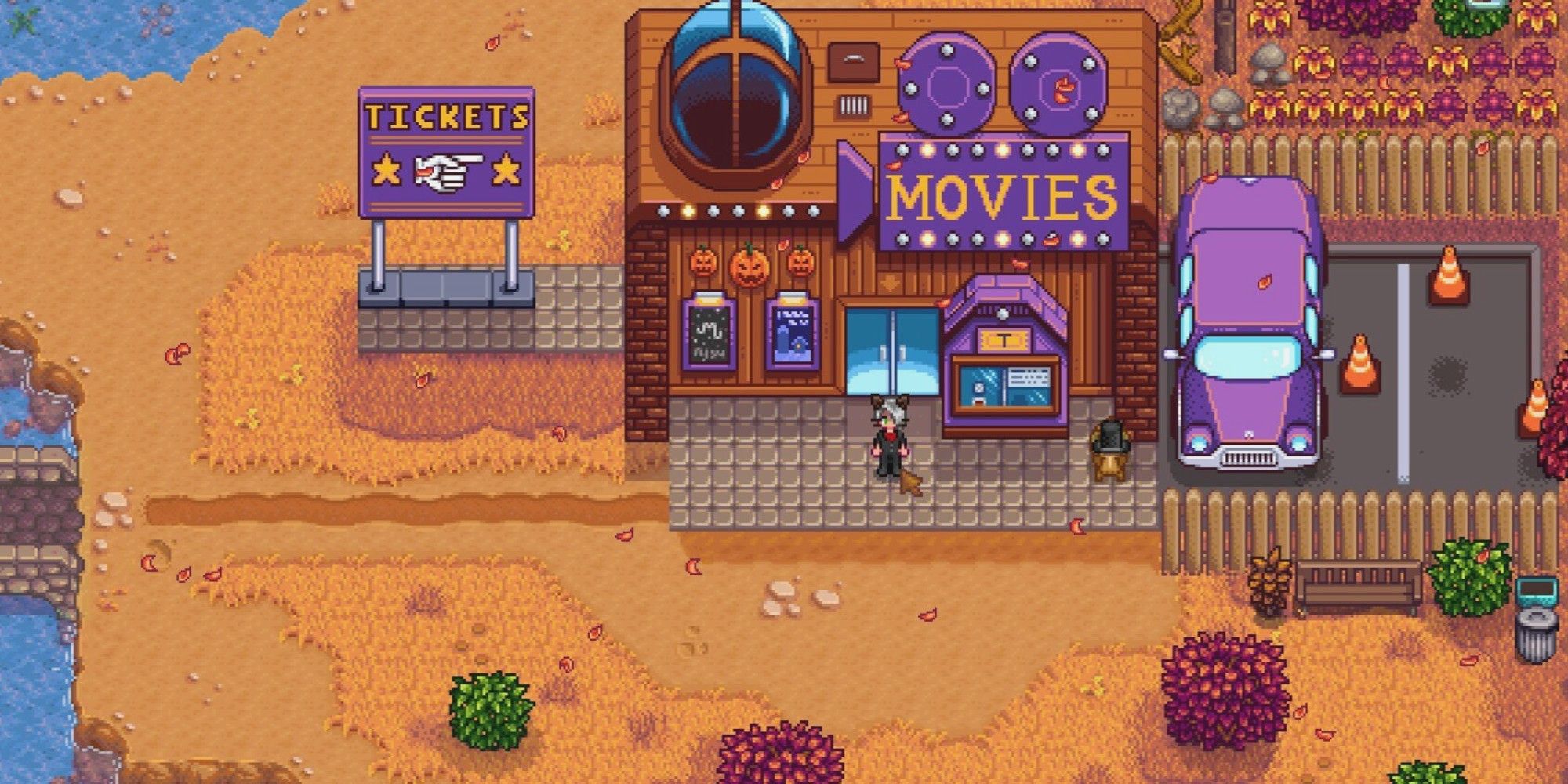movie theater building in stardew valley with player standing outside