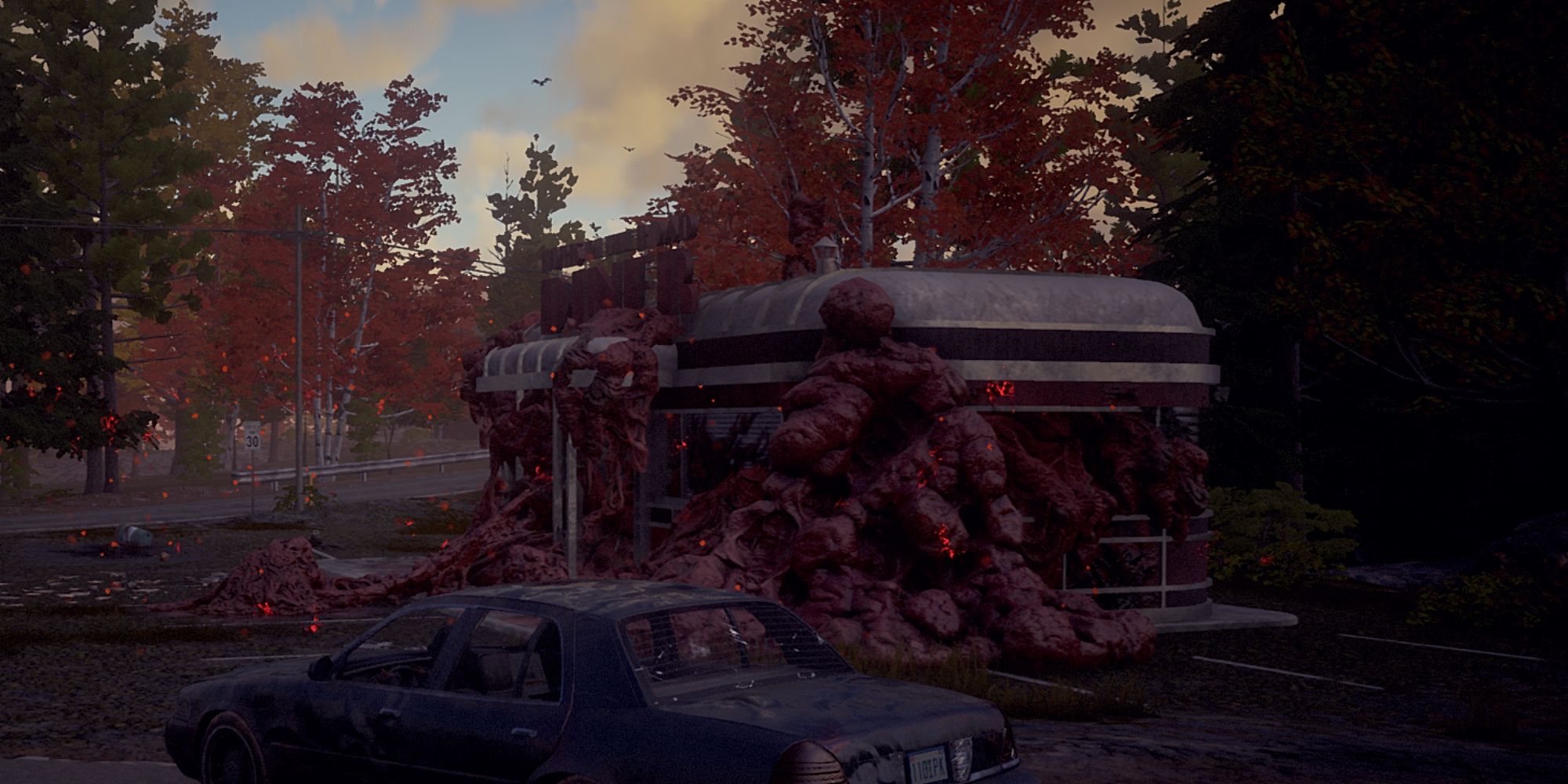 State of Decay 2 car next to plagued diner in trumbull valley