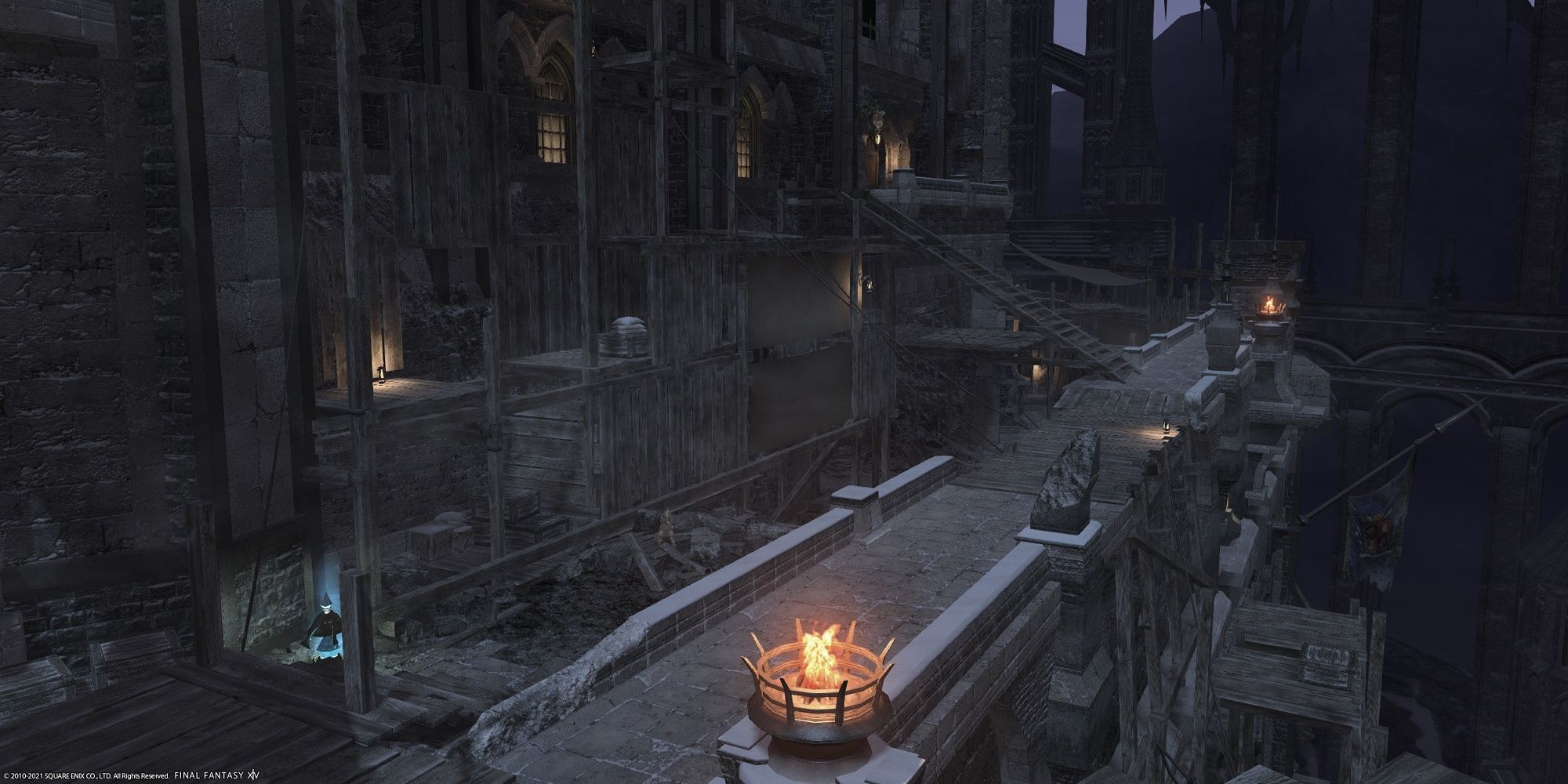 The Brume district of Ishgard seen at Night with flaming braziers lighting the street