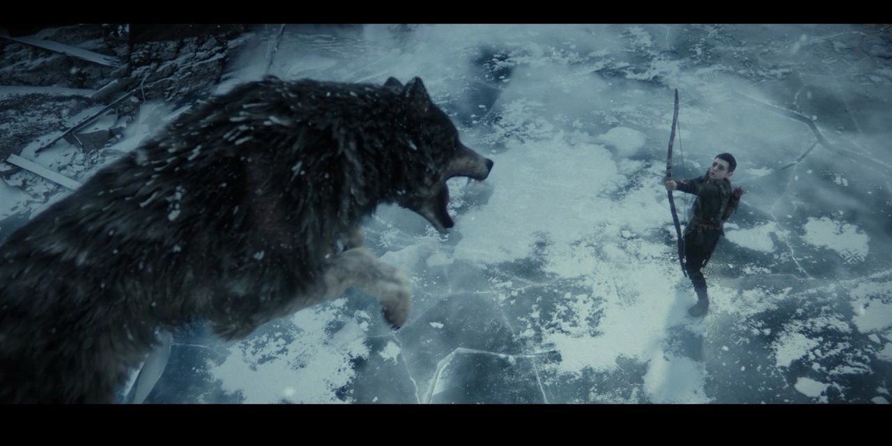 Atreus shooting at a wolf
