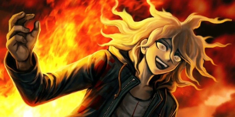 Nagito smiling with fire in the background. 