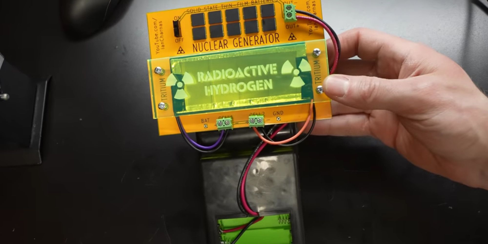 a nuclear powered gameboy battery consisting of tritium tubes and solid state batteries