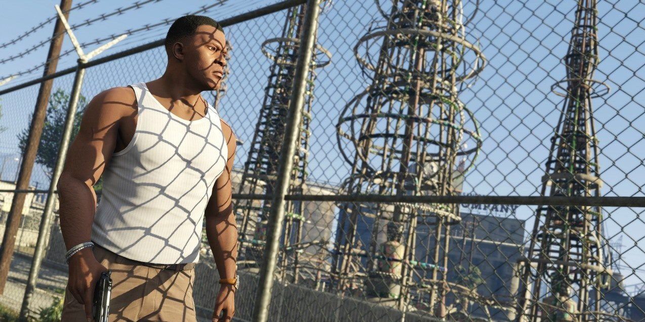 Franklin walking along a fenced off power plant in GTA 5