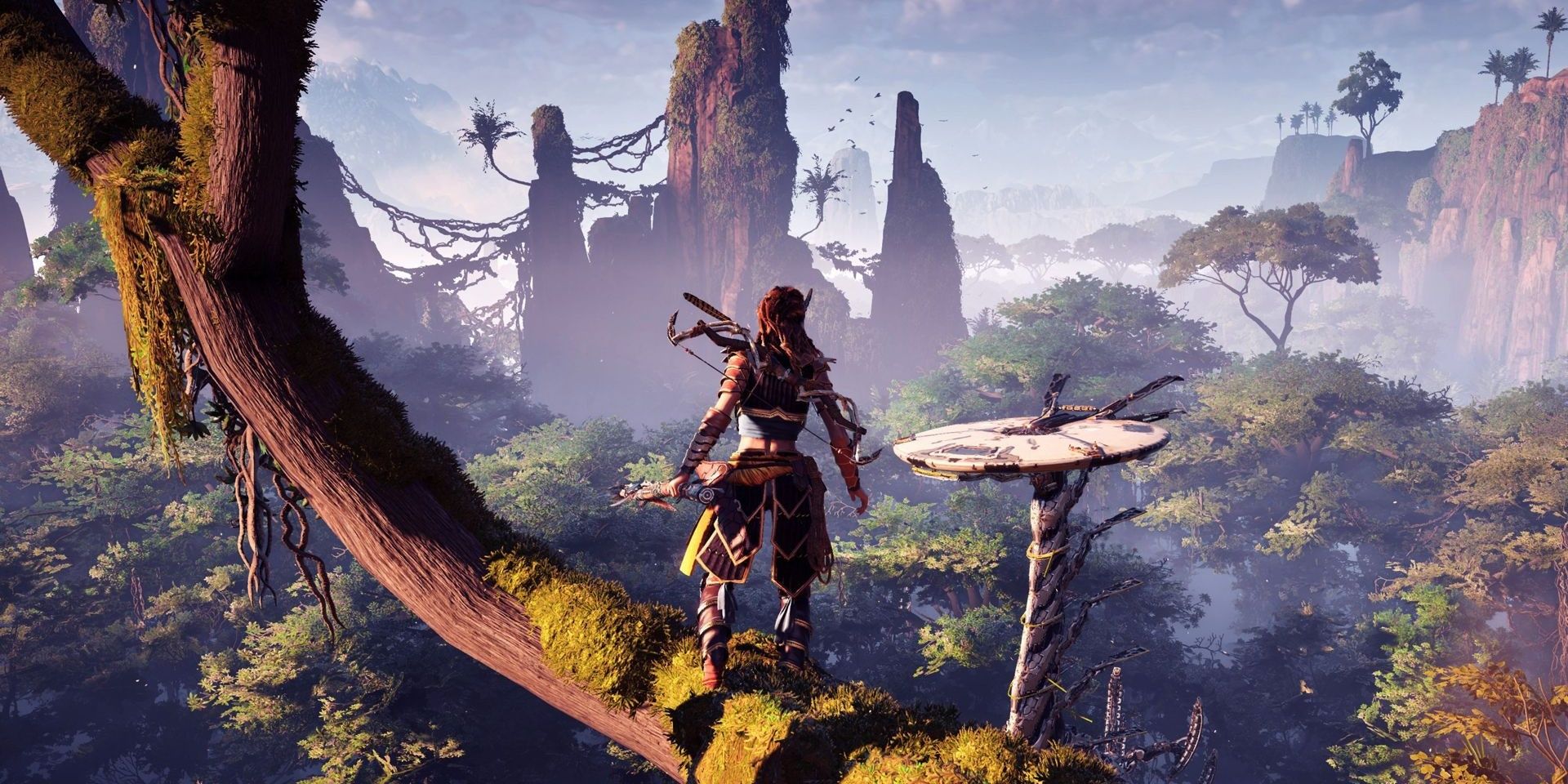 Aloy standing on a tree branch overlooking the forest in Horizon Zero Dawn