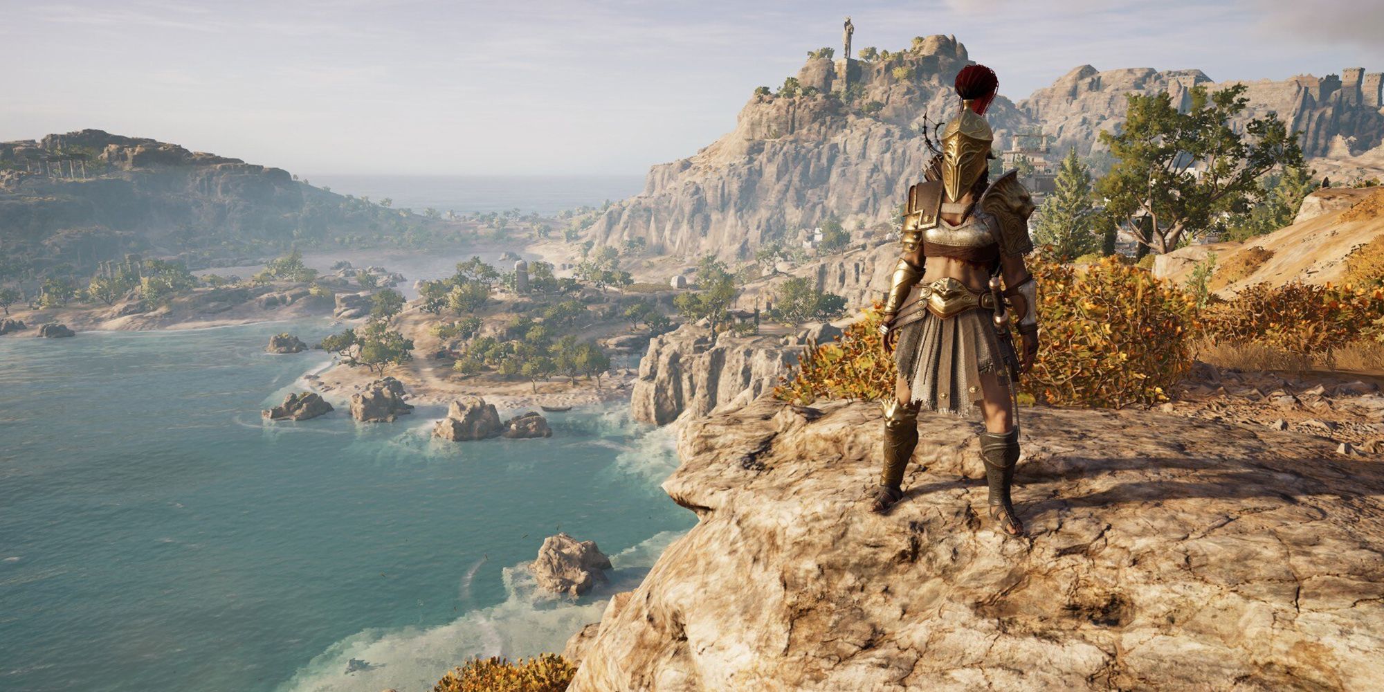 Assassin's Creed Odyssey – Kämpfer-Rüstungsset, das auf einer Klippe im Arena-Kampf posiert