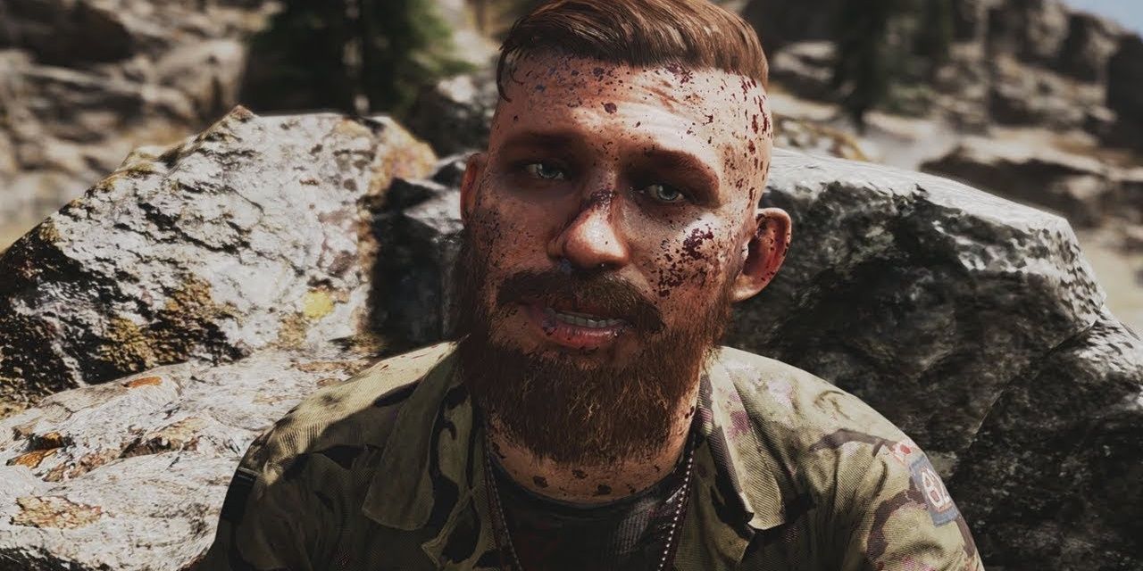 Jacob Seed in Far Cry 5 close up shot by rocks with blood on his face