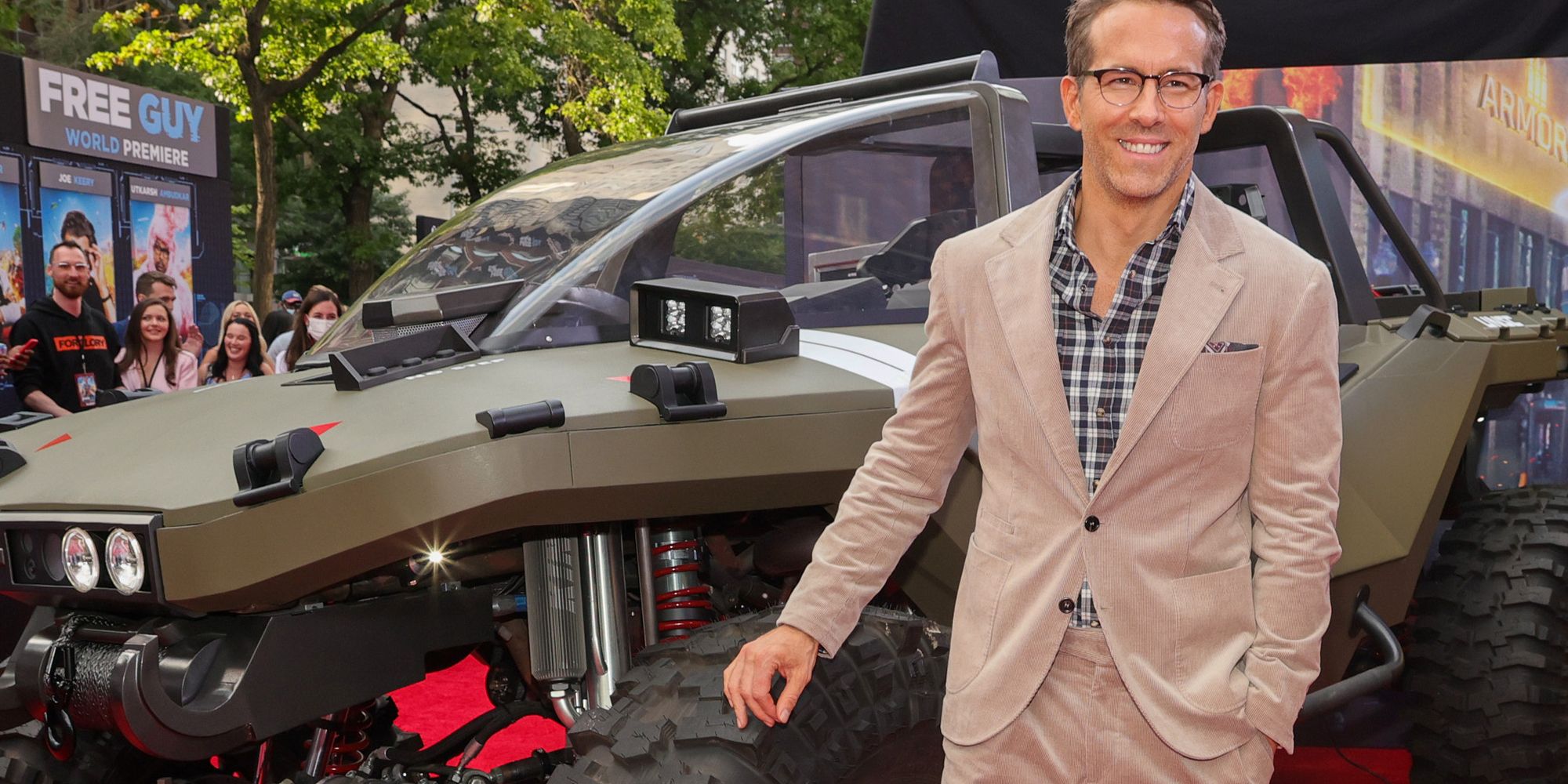Ryan Reynolds standing in front of a Halo warthog for the Free Guy premiere