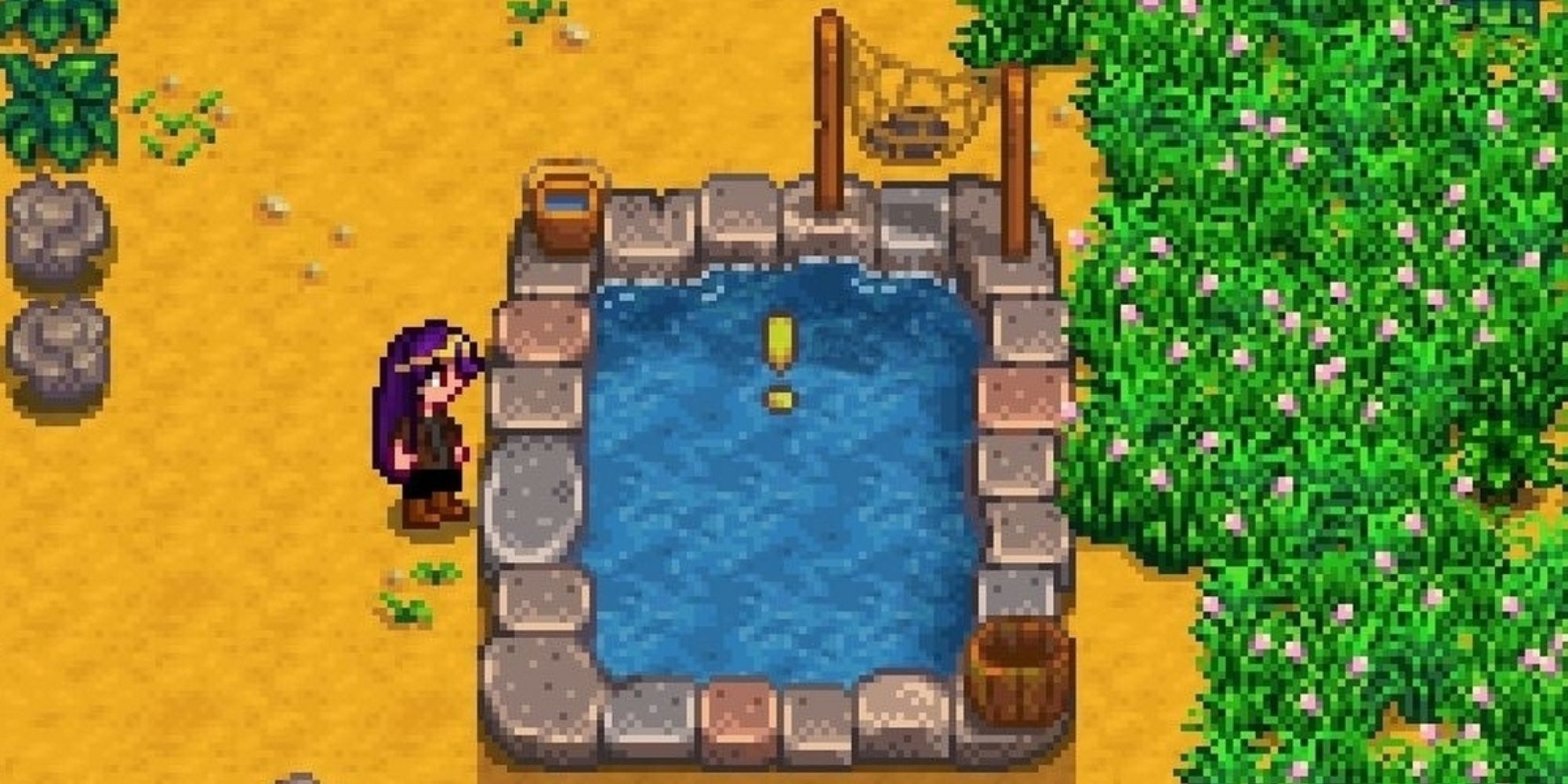 Stardew Valley: An image of the player character standing besides a Fish Pond marked with a yellow exclamation point